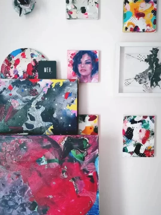 paintings stacked in the studio of artist asma kazi